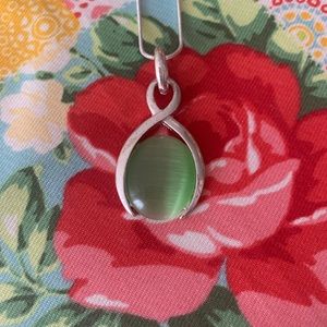 Lovely Light Green Cats Eye pendant on Silver Chain